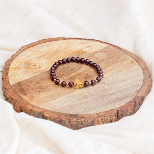 garnet bracelet with golden butterfly